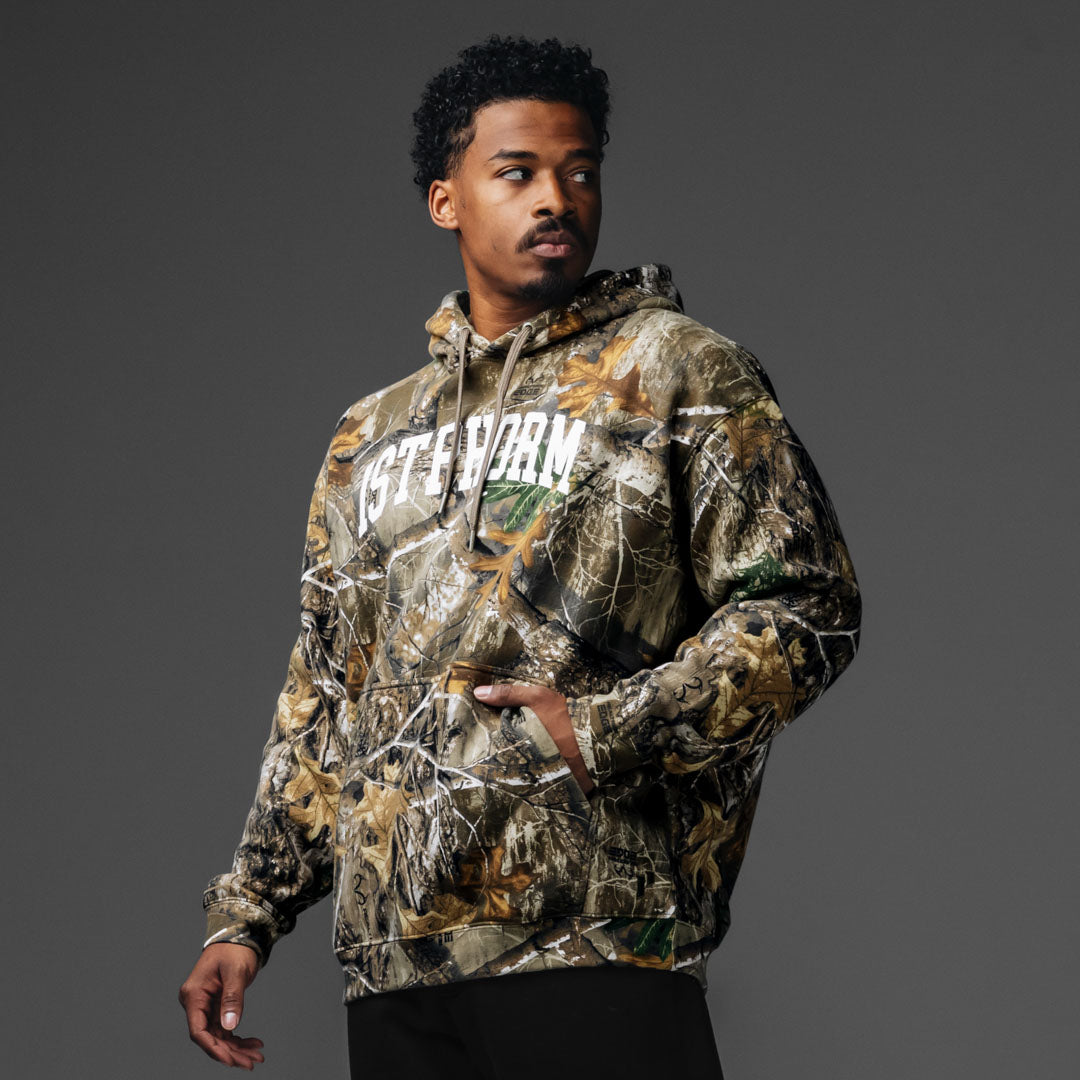 reformed / リフォメッド CASTRO JAMPER CAMO RealTree Varsity Hoodie | 1st Phorm
