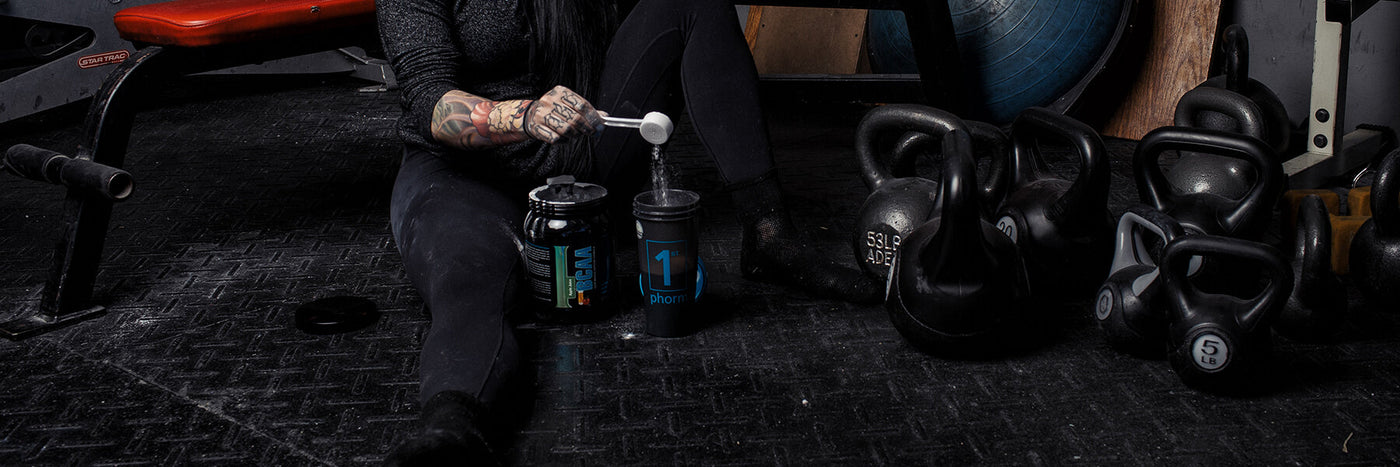 Person Pouring BCAAs