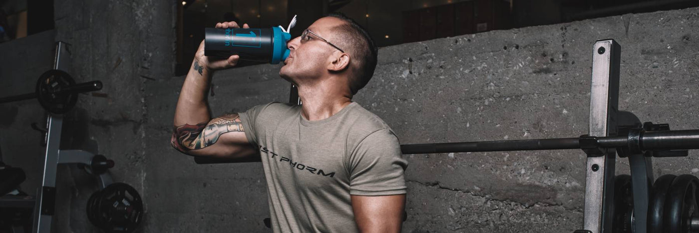 Man Drinking From a Shaker Cup