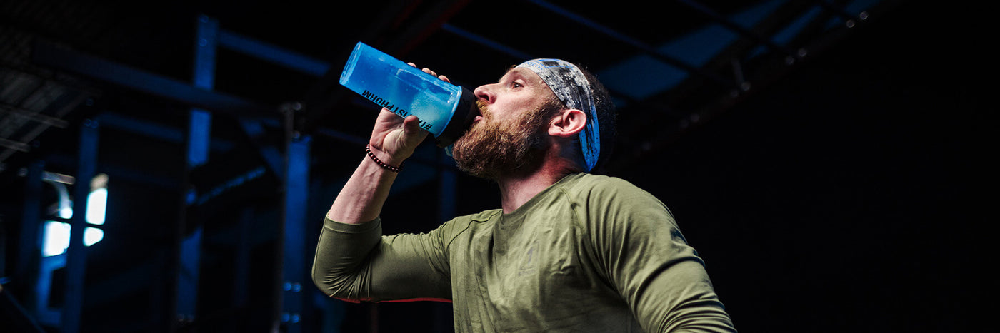 Man Drinking From a Shaker Cup