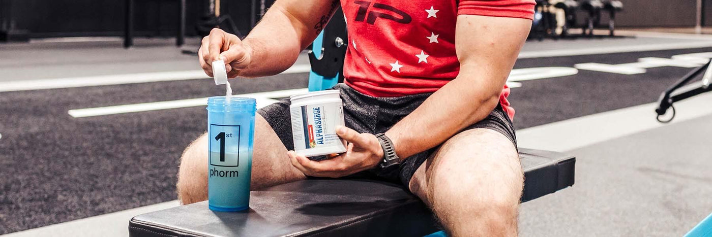 Man Pouring Megawatt Pre-Workout Into a Shaker Cup