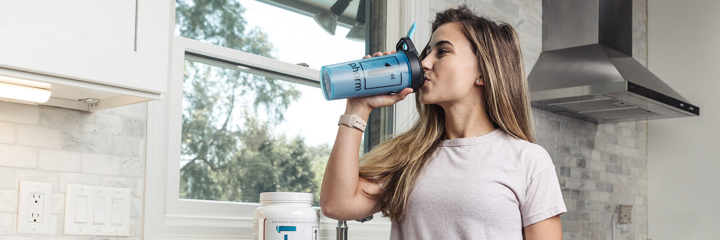 Woman Drinking From a Shaker Cup