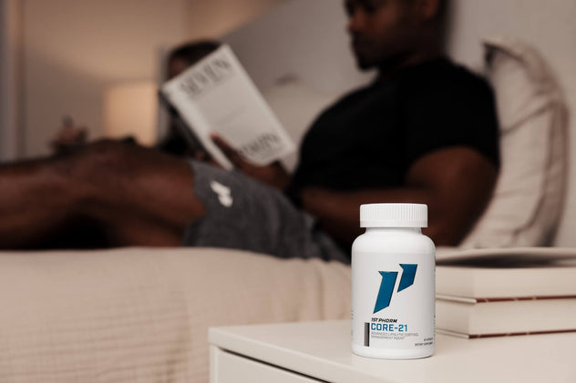man in bed resting reading book with core 21 on nightstand