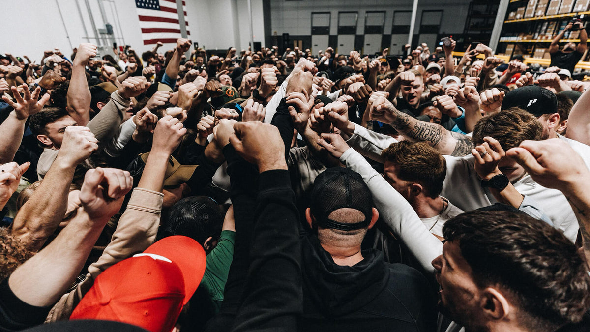 1st Phorm employees huddle together in warehouse
